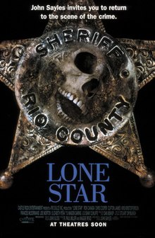 A sheriffs star shaped badge with the image of a skull superimposed