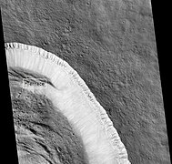 Pangboche Crater, as seen by HiRISE. Pangboche Crater is a very young 11 km diameter crater near the summit of Olympus Mons. Notice the steep walls.