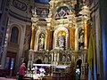 Woman praying before the Altar of Answered Prayers