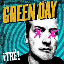A black-and-white cutout of Tré Cool's head, his eyes covered with pink X's, on a geometric, neon electric blue background. The words "Green Day" are on top in yellow, capital letters, where as "¡Tré!" is in white & in the bottom left corner.