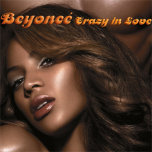 Left side of the face of a brunette woman with soft makeup. Behind her, the chest of a naked man is visible. The words "Beyoncé" and "Crazy in Love" are written above her image.