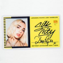 A picture of Dua Lipa with appears on the left side of a black and yellow card. The right side features her name along with Silk City's, as well as the cities London, Paris, Los Angeles, Detroit, Chicago, and New York.