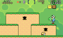 This screenshot shows Luigi riding Yoshi during one of the game's early stages in the Game Boy Advance version. The scenery shows a jungle environment with floating blocks scattered in the air. The interface displayed along the top of the image shows the number of lives, point multiplier, special item, time remaining, number of coins and total score.