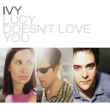In the cover artwork for American band Ivy's "Lucy Doesn't Love You", the top half of the image is a white background with the words "Ivy" and "Lucy Doesn't Love You" appearing in an all-caps black and gray font, respectively. The bottom half of the image consists of 3 images of the individual band members; from left to right: Dominique Durand, Andy Chase, and Adam Schlesinger.