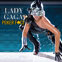 Water drips from a masked Lady Gaga as she crawls out of a swimming pool and towards the camera.