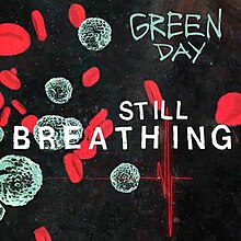 Cover artwork of "Still Breathing": Red blood cells, white blood cells, and an EKG line appear over a dark background. The title, "Still Breathing," is printed in the center; the band's name, "Green Day," is printed in the top-right corner.