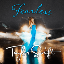 Cover artwork of "Fearless", showing Swift standing in the rain