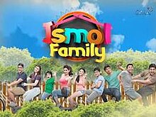 An image of the cast standing over a wood fence. The series title is displayed on the upper center of the image. The logo of GMA Network is displayed on the upper right side of the image.