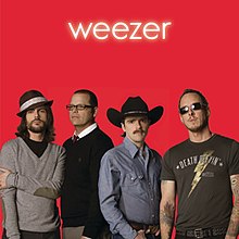 The band photographed on a red background