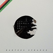 A cream-colored background with a black disk in the center that lists the artist and album name and a small band of red, black, and green stripes