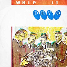 A 7-inch single cover showing five men huddled around a globe. The image features distorted colors. The words "WHIP IT" and "DEVO" appear at the top of the cover.