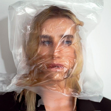 Kesha with a plastic bag over her head.