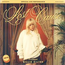 Cover art for the official live performance of "Lost Cause": Billie Eilish by a ballroom's balcony, sporting blonde hair and wearing a white sweater. Above her head is the song title, written in yellow and in a cursive font.