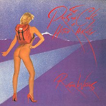 a nude back-view image of a blonde woman wearing a red backpack and red stilettos sticking her thumb out, her buttocks clearly visible