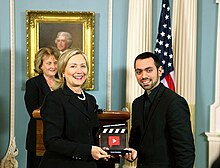 Farbod Khoshtinat receiving the democracy video award from the US Secretary of state Hillary Clinton, September 2010