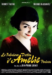 Against a bright green background is a young woman, wearing a red sweater. Her dark hair is cut into short bob and her lips are red and her skin pale. She smiles mischievously. The full title is included below in large yellow lettering.