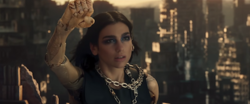 Dua Lipa with raising her cyborg arm with a apocalyptic city behind her
