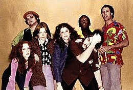 The original cast of SNL posing for the camera