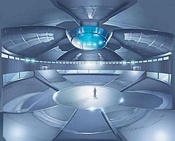 Drawing of a large, enclosed, futuristic arena with a man standing at the centre; large ramps lead to galleries above.
