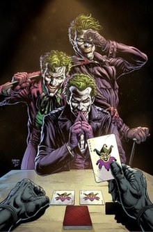 The perspective of Batman seated at a card table, drawing three Joker cards while looking at three Jokers before him.