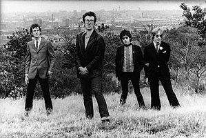 Costello and the Attractions in 1979. L–R: Pete Thomas, Elvis Costello, Steve Nieve and Bruce Thomas