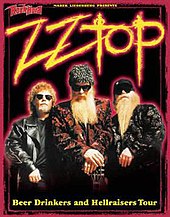 A black poster with loud colors occupying most of it. The image shows ZZ Top facing forward as Billy Gibbons has his hands resting on the headstock of a guitar. The text on the poster reads "ZZ Top Beer Drinkers and Hellraisers Tour".