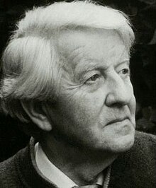 Three-quarter profile press photo of an elderly, clean-shaven man with white hair and strong features.