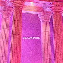 A pink to purple picture of four corinthian orderd pillars and the Blackpink logo in the center.