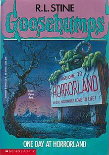 A green monster with red eyes, long horns, and claws mostly behind a sign with words that welcome people to the theme park HorrorLand with that theme park to the left of the monster in the far background.