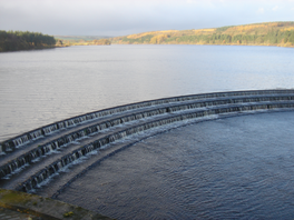 Image of a reservoir with water cascading on the overflow