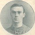 Faded photo of a clean-shaven white man in a sports jersey