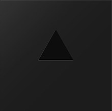A matt-black, square box with a gloss-black triangle at the centre.