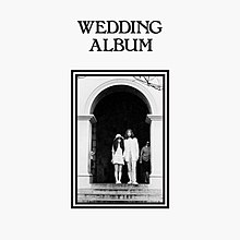 a mostly blank cover with a photo of John Lennon and Yoko Ono in an archway and the album title printed above.