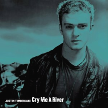 A blueish colored portrait of a young blonde-haired man who is wearing a black shirt and a black leather jacket. In the left bottom corner is not written his name "Justin Timberlake" and the track's title 'Cry Me a River' in white letters.