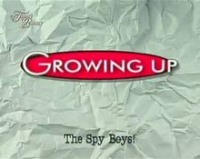 An image of a white crumpled paper. The series title is displayed on the center of the image. The text "Spy Boys!" are written in the lower center of the image. The text "Tunay na Buhay" is seen in the upper left side of the image.