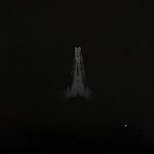 A black cover with a photograph of two black hands praying