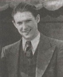 Gottfredson smiling in a suit