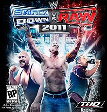 3 different wrestlers are seen on the cover. On the left, Big Show clenches his fist. In the middle, John Cena holds his arms up and on the right, The Miz is holding a wrestling title belt and is screaming into a microphone. The game's logo is seen above.