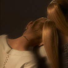Cover art variant of Eternal Sunshine: a back-view picture of Ariana Grande with a blonde ponytail, leaning towards the shoulder of a lookalike