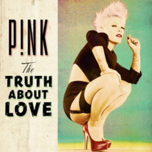 A woman with pink hair behind a green background crouching down with her right hand leaning on her right knee and her left hand up. She is donning a short black top, short black shorts, garters, and red heels. On the left of the image a beige strip displays the words P!NK and TRUTH ABOUT LOVE in black capital letters, while above the latter is written The in cursive