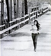Photograph of Bobbie Gentry crossing the Tallahatchie Bridge in Money, Mississippi