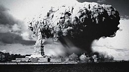 A mushroom cloud emerges over a destroyed city, with the Statue of Liberty in the foreground.