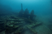 The wreckage of a submerged ship, featuring one of its paddle wheels