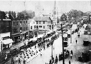 A parade on Washington Street, Norwood, c. 1920. Looking north towards Norwood Common (on right in distance)