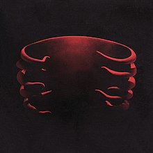 Cover art for Undertow, featuring a red 3D model of a ribcage designed by Adam Jones
