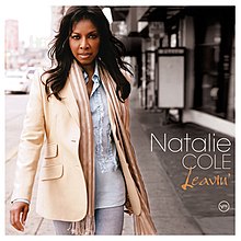 A woman in a jacket and jeans is shown walking toward the camera. The words Natalie Cole are shown in the right lower-hand corner in a white font along with the word Leavin' in an orange, cursive font.