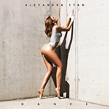The cover sees Stan posing provocative in front of a beige backdrop