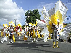 Parade of costumed carnival dancers