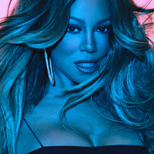 A blue-tinted image of Carey in a dark strapped dress, against a light-pink background.