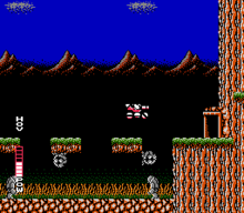 A pink vehicle (which is SOPHIA THE 3RD) is in the center of the screen, jumping from a floating platform to a door on the right side of the screen. Below the floating platform are grey wall-walking enemies, a grey statuesque walking enemy, and a swamp-like bottom. The background consists of mountains in a dark blue sky.